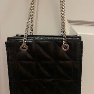 Black quilted purse with silver studs. No damages